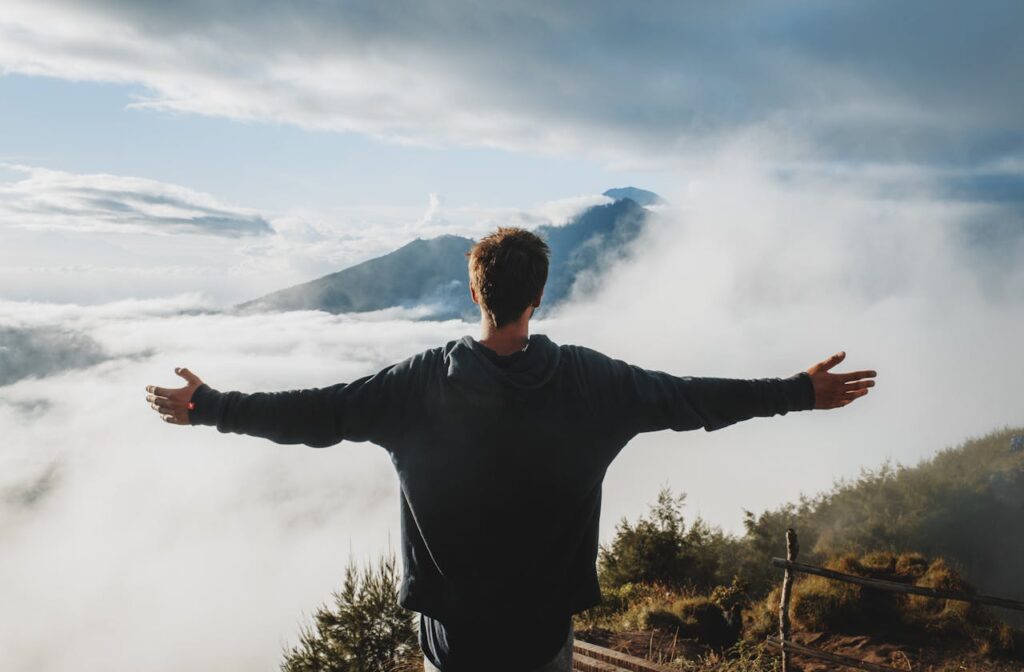 pexels-photo-4552990-4552990 Boy/man Standing at the edge of the Mountain, enjoying the View